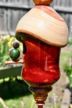 a close up of a red bird feeder