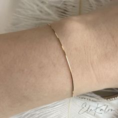 Modern sleek thin snake chain bracelet handcrafted in 14K solid gold. A subtle statement piece for your wrist. Matching style with our Gold Thin Snake Chain Necklace. Ships within 3 business days. - Chain width: 0.6mm - Chain length: choice of 6.25", 6.75" or 7" - Made in 14 karat gold. - Stamp with AU585(14K). Solid Gold Bracelet, Snake Chain Necklace, Snake Chain Bracelets, Gold Bracelets, Matches Fashion, Snake Chain, Delicate Bracelet, Chain Lengths, Chain Length