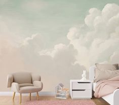 a bedroom with a bed, chair and clouds painted on the wall behind it in pastel tones