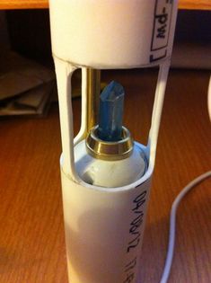 a close up of a blender on a wooden table