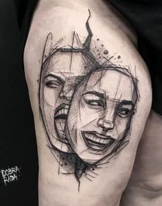 a woman's thigh with an abstract face tattoo