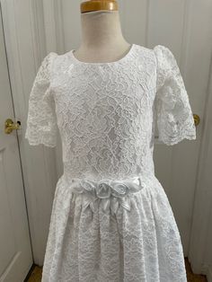 "This is a beautiful CLASSIC Communion Dress, lace Vintage dress NEW never worn, it was part of my inventory when we had our Children's Clothing Shop, dresses are in excellent condition. Dress features a nice lace with scalloped edging on the hem, and on the sleeves. Dress is fully lined, except the sleeves; 3 layers: acetate lining with tulle ruffle, and silkie soft satin underneath lace, please look at the pictures, dressed was nicely crafted; You may add a full slip if, you wish dress to look Communion Dresses Lace, Lace Vintage Dress, Lace Dress Short, White Lace Dress Short, Scalloped Sleeves, Lace Dress Vintage, Lace Vintage, Scallop Hem, Taffeta Dress