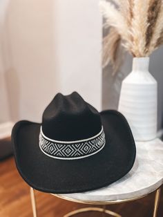 How cute is this braised strap detail cowboy hat? We know the western trend is in and this hat is the perfect accessory to top off your chic style! Hat features pattern strap, western fit, and adjustable strap inside 100% Polyester Measures 15” from front to back Brim is 4” wide Western Style Fedora With Adjustable Fit, Western Fedora With Adjustable Fit, Adjustable Fit Country Fedora For Rodeo, Adjustable Fedora Hat Bands For Rodeo, Country Style Adjustable Fedora For Rodeo, Adjustable Country Style Fedora For Rodeo, Western Hat Bands With Adjustable Fit, Western Fedora With Adjustable Fit And Short Brim, Western Style Adjustable Fedora Felt Hat