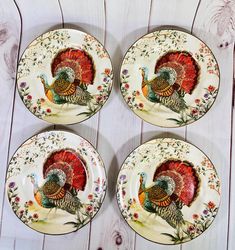 four turkey plates sitting on top of a wooden table