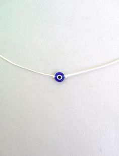 Evil eye choker necklace, String choker, Minimalist The evil eye is used to protect the person that wears it from the malevolent look of others who envy or dislike that person. The necklace is made with 1mm black waxed string,and has a 8mm blue glass evil eye bead. At the end it is adorned with seed beads. Total length: 80cm / 31 inches It is adjustable to fit a lot of sizes. Custom orders for different colour combinations are welcome. Other necklaces in my shop: https://www.etsy.com/shop/LuckyR Adjustable Evil Eye Choker, Adjustable Evil Eye Choker Jewelry, Adjustable Evil Eye Amulet Necklace, Adjustable Round Evil Eye Necklace, Adjustable Evil Eye Spiritual Necklace, Adjustable Spiritual Evil Eye Necklace, Nazar Necklace, Blue Evil Eye Necklace, Evil Eye Choker