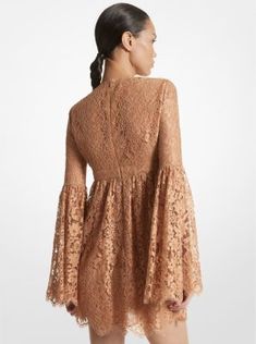 Capture the essence of ‘60s-inspired dressing in this floral lace mini dress, which debuted on the Spring/Summer 2024 runway. Dramatic bell sleeves, an empire waist and a plunging neckline combine to create an ultra-feminine silhouette. Lean into the bohemian aesthetic with dainty sandals and a bucket bag to complete the look. Dainty Sandals, 2024 Runway, Bohemian Aesthetic, Ultra Feminine, Empire Dress, Feminine Silhouette, The Bohemian, Spring Summer 2024, Inspired Dress