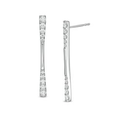 your story - all the moments big and small - with these chic journey diamond drop earrings. Fashioned in cool 10K white gold, each sleek linear drop features a polished bar gleaming between ribbons of graduated-size diamonds - the largest being 1/10 ct. each. Radiant with 1 ct. t.w. of diamonds and a brilliant buffed luster, these post earrings secure comfortably with friction backs. Through graduated stones and gold details, this design celebrates how love grows and perseveres throughout your u Modern Linear Earrings With Diamond Accents For Formal Events, Modern Linear Earrings With Diamond Accents For Formal Occasions, Modern Linear Earrings For Anniversary, Modern Diamond Linear Earrings, Modern Linear Earrings With Diamond Accents, Modern Formal Diamond Earrings Channel Set, Modern White Gold Linear Earrings With Diamond Accents, Modern White Gold Linear Earrings For Anniversary, Minimalist White Gold Linear Earrings For Anniversary