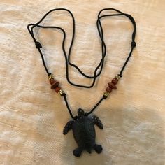 Pretty Adjustable Turtle Necklace. The Turtle Is Black And Made Of Wood. Measures 17 Inches. Nwot Black Casual Necklace With Adjustable Cord, Casual Black Necklace With Adjustable Cord, Casual Black Pendant Jewelry, Black Beach Jewelry With Adjustable Cord, Casual Black Necklace For Gift, Handmade Black Necklace For The Beach, Handmade Black Necklace For Beach, Turtle Necklace, Made Of Wood