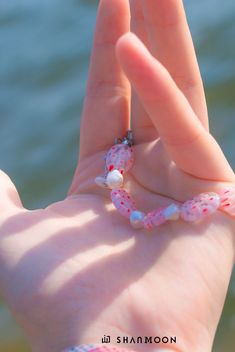 Flowing with effortless grace in a mesmerizing blend of blue and marine hues, this bracelet is a celebration of the ocean's hidden treasures, crafted with skillful artistry and woven with secrets waiting to be discovered. Material: Flower Glass Beads, Freshwater Pearls Craft: Handmade Size: 18-24cm Color: Pink Care: Keep away from chemicals; Avoid scratches; Clean with a soft fabric *This item is non-refundable. Ocean-inspired Bangle Jewelry For Gifts, Unique Colorful Beaded Bracelets For The Beach, Ocean-inspired Strand Jewelry For Festivals, Ocean-inspired Bracelet Jewelry Gift, Adjustable Beaded Ocean-inspired Jewelry, Colorful Beaded Bangle For Beach, Colorful Beaded Strand Bracelets As Gift, Unique Beaded Bracelets For Beach, White Single Strand Beaded Bracelet For Gift