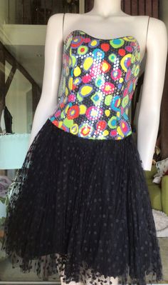 "Vtg 80s A J Bari Tulle Skirt Sequinned Boned Bodice Party Dress XS Preowned. Very good vintage condition. 9.5/10 Style Disco, cocktail, formal. Cotton boned bodice printed in multicolour circular pattern red, yellow, cyan, purple. Totally covered in clear sequins. The gorgeous skirt comprises firstly a normal layer of black satin material, followed by two layers of stiffened black tulle, the outer skirt being a layer of sheer black net covered with black polka dots. The end result is a striking Fitted Skirt For Dance Party Season, Fitted Skirt For Dance And Party Season, Retro Fitted Skirt For Party, Fitted Skirt For Dance During Party Season, Retro Stretch Skirt For Party, Fitted Disco Evening Skirt, Retro Fitted Dresses For Festival, Retro Stretch Dress For Party, Vintage Stretch Skirt For Party