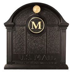 a black and gold mailbox with the letter m on it's front cover