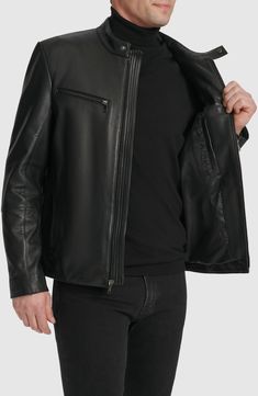 Bring a touch of moto edge to your cool-weather look with this leather jacket authenticated with a stand collar and tonal zip hardware. 25 1/2" length Front zip closure Stand collar Zip cuffs Chest zip pockets; front zip pockets Lined Leather Professional leather clean Imported Leather Jacket With Zipper Pocket And Long Sleeves, Modern Black Leather Jacket With Zip Fly, Black Business Leather Jacket With Zip Cuffs, Black Leather Jacket With Zip Cuffs For Business, Leather Jacket With Asymmetrical Zip And Zipper Closure, Modern Black Leather Jacket, Solid Biker Outerwear With Zipper Closure, Biker Style Solid Outerwear With Zipper Closure, Modern Biker Jacket With Zipper Closure For Winter