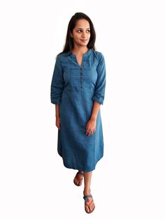 "Beautiful and breathable 100% medium weight khadi fabric. A perfect piece for those effortless style days. A flattering double tone blue and black coloured semi-lined dress,It comes with pleats detailing at the front yoke and wooden buttons for the opening in front. A minimalistic piece of clothing that will make you look trendy all day long without compromising with your comfort,this is one of those pieces you are surely going to love.  Beautiful and rustic shade of blue,great for this christm Indigo Cotton Dress With Relaxed Fit, Long Sleeve Indigo Cotton Dress, Indigo Long Sleeve Cotton Dress, Indigo Relaxed Fit Cotton Dress, Indigo Knee-length Cotton Midi Dress, Casual Straight Kurta Dress For Summer, Casual Indigo Kurta For Summer, Indigo Cotton Tunic Dress, Fitted Cotton Tunic Midi Dress