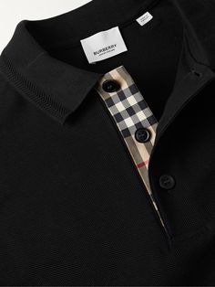 Burberry updates the classic polo shirt with an embroidered tonal monogram at the chest and its iconic check along the placket. This version is cut from cotton-piqué and detailed with herringbone stiches along the collar. Burberry Collection, Burberry Polo Shirt, Polo Fashion, Burberry Logo, Burberry Shirt, Polo Shirt Design, Polo Logo, Burberry Men, Pique Polo Shirt