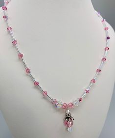 Rose Pink is one of October Birthstones. Swarovski Crystal Necklace. Sterling silver lobster claw clasp. Handmade in Brooklyn. Matching Earrings Available. A great birthday gift or treat Yourself! I started making my own Jewels at our kitchen table almost 30 years ago. Now at 68 years old and saving for retirement most evenings you will find me at my desk in our living room creating jewels after a day of Zoom calls. Feeling grateful that  I can still create Jewels that are a pleasure to look at Pink Crystal Jewelry For Mother's Day, Pink Crystal Necklaces For Mother's Day, Pink Crystal Necklace For Mother's Day, Pink Sparkling Stones Jewelry Gift, Pink Jewelry With Sparkling Stones For Gift, Pink Sparkling Stones Jewelry For Gifts, Elegant Crystal Jewelry For Birthday, Mother's Day Pink Crystal Necklace, Handmade Crystal Jewelry For Gift