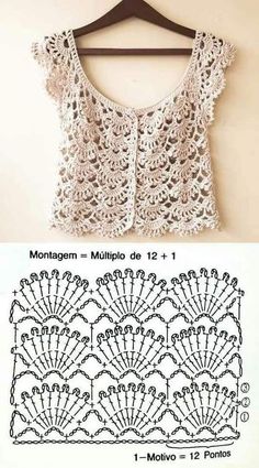 the crocheted top is hanging on a hanger and it has two rows of lace