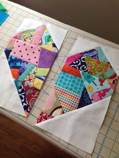 the quilts are being sewn together on the table