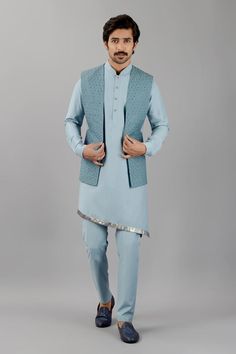 Dusty aqua blue terry rayon nehru jacket with tonal geometric and saali embroidery.
Components: 1
Pattern: Embroidered
Type Of Work: Tonal geometric, Saali
Neckline: Open
Sleeve Type: Sleeveless
Fabric: Terry rayon
Color: Blue
Other Details: 
Note : Kurta and pant worn by the model are not for sale.
Occasion: Sangeet - Aza Fashions Unstitched Blue Nehru Jacket With Dabka, Blue Unstitched Nehru Jacket With Dabka, Fitted Blue Nehru Jacket With Chikankari Embroidery, Blue Nehru Jacket With Chikankari Embroidery For Festive Occasions, Festive Blue Nehru Jacket With Chikankari Embroidery, Festive Blue Nehru Jacket With Dabka Detailing, Blue Cotton Nehru Jacket With Zari Work, Blue Nehru Jacket With Dabka Work For Festive Occasion, Blue Cotton Nehru Jacket For Wedding