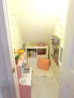 a room with a bed, desk and bookshelf