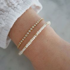 Add a special touch to your look. Our Birthstone Bead Collection styles are crafted with natural stones and three 14k gold rondelles strung on a coated wire for maximum durability. Wear your own birthstone—or a loved one’s—for a meaningful layer in any bracelet stack. Pearl is June's birthstone. Elegant 14k Gold Filled Rondelle Jewelry, Delicate Adjustable 14k Gold Beaded Bracelet, Adjustable Delicate 14k Gold Beaded Bracelet, Delicate Hand-strung Jewelry For Everyday, Elegant Adjustable Pearl Bracelet With Birthstone, Elegant Wedding Beaded Bracelets With Birthstone, Elegant Beaded Bracelets With Birthstone For Wedding, Elegant Beaded Birthstone Bracelets For Wedding, Everyday Round Beads Birthstone Bracelets