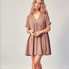 Mauve/Tan Textured Dress With Beautiful Detailing Neutral V-neck Spring Dress, Brown V-neck Mini Dress For Spring, Neutral V-neck Dress For Daywear, Casual Brown V-neck Mini Dress, Casual Khaki V-neck Dress, Beige Short Sleeve Mini Dress For Fall, Brown Short Sleeve Day Dress, Beige Mini Dress With Short Sleeves For Fall, Neutral Knee-length Summer Dress