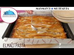 a person cutting food in half with a knife and fork on top of a pan