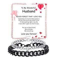 a black and white chain bracelet with an i love you message on the front, two hearts