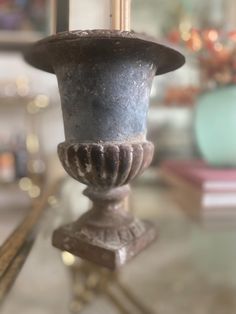 a candle holder sitting on top of a glass table