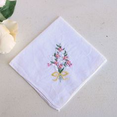 Charming Vintage Hanky In Linen With Embroidered Flowers In Pink And Whte With Green Leaves Tied With A Yellow Ribbon. Hemmed Edges. Approx 10.5" Square. No Labels Or Marks. Perfect For Any Hanky Collector! Looks And Feels Like A Cotton Or Cotton Linen Blend. Near Mint Vintage Condition. Looks Unused. Please Note: These Are Vintage, Preworn And/Or Preloved Items. I Do My Best To List Any Issues, But Signs Of Wear Should Be Expected. Please Feel Free To Contact Me With Any Questions. I'm Truly Ha Summer White Handkerchiefs Gift, White Handkerchiefs As Spring Gifts, White Handkerchiefs For Spring Gifts, Spring Gift White Handkerchiefs, Vintage Embroidered Summer Handkerchiefs, White Floral Embroidered Handkerchiefs For Gifts, Floral Embroidered Handkerchiefs For Spring Wedding, White Floral Embroidery Handkerchiefs For Gift, White Cotton Handkerchiefs For Spring