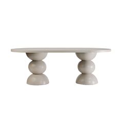 a white table with two balls on it's legs and an oval shaped top