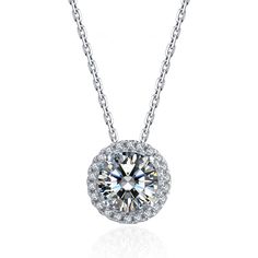 With a round moissanite at the core and a halo encircling it, this moissanite pendant necklace is a glittering marvel. It gives off the illusion of a sparkling star and looks extravagantly elegant. Features Moissanite was originally found in meteorites(Chemical name: Silicon Carbide). It was first discovered in 1893, while a scientist was examining meteor samples from a crater in Arizona. After many years, the experts has been recreated moissanite in the laboratory, that make the gemstone with f Dazzling Silver Solitaire Necklace With Halo Design, Dazzling Cubic Zirconia Diamond Necklace With Halo Design, Moissanite Necklace With Halo Design In Diamond White, Diamond White Solitaire Necklace With Halo Design, Formal Solitaire Pendant Necklace With Halo Design, Formal Solitaire Necklace With Halo Pendant, Formal Pendant Solitaire Necklace With Halo Design, Diamond White Solitaire Pendant Necklace With Halo Design, Round Pendant Moissanite Jewelry With Halo Design