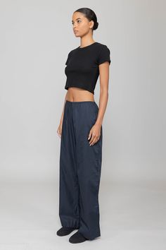 Cut in our anything but basic Kelly Cotton Rib, The Kelly Crop Slim Fit Tee is the perfect high waist pant companion. Featuring a crew neckline, a just right cropped length, and clean, tailored finishing. Black Cropped Cotton Bottoms, Casual Stretch Bottoms With Cropped Hem, Versatile Relaxed Fit Crop Top For Loungewear, Versatile Cropped Bottoms For Loungewear, Cotton Crop Top With Elastic Waistband, Everyday Cropped Cotton Bottoms, Relaxed Fit Cotton Bottoms With Cropped Hem, Cotton Relaxed Fit Cropped Bottoms, Relaxed Fit Cropped Cotton Bottoms