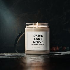 a candle that says dad's last nerve on it