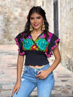 This beautiful Butterfly Sleeve Crop Top is the perfect Top for a fun day out or special event. The adorable fluttery sleeves and colorful embroidered flowers make it flirty and fun. It's made out of cotton, has an elastic waist and has colorful flowers embroidered by Artisanal Machine. This blouse is made with love by Mexican Artisans in Chiapas, Mexico. Purchase the gold plated filigree earrings here: https://www.etsy.com/es/listing/870716921/aretes-mexicanos-de-filigrana-aretes?ref=listings_m Top Mariposa, Low Cut Crop Top, Flowers Embroidered, Floral Embroidered Top, Butterfly Sleeve, Floral Butterfly, Filigree Earrings, Butterfly Sleeves, Floral Top