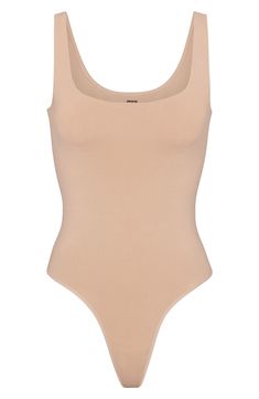 This scoop-neck bodysuit is the perfect everyday essential for light smoothing and support for your waist. It features a double scoop neck and a thong back that make it seamless under clothing. Pull-on style (no snap closure) Scoop neck Thong back Cotton-lined gusset 85% nylon, 15% elastane Hand wash, line dry Imported Stretch Leotard With Built-in Bra And Scoop Neck, High Cut Seamless Summer Leotard, Low Back Seamless Bodysuit With Minimal Stretch, High Cut Summer Bodysuit With Minimal Stretch, High Cut Smoothing Leotard For Summer, High Cut Bodysuit With Minimal Stretch For Summer, Seamless Bodysuit With Minimal Stretch And Low Back, Seamless Low Back Bodysuit With Minimal Stretch, Summer High Cut Smoothing Leotard