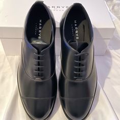 A Glossy Satin Leather Construction Lends Polish To These Classic Lace-Up Dress Shoes Featuring Technogel Insoles For Optimal Comfort. Leather Upper Almond Toe Lace-Up Vamp Leather Lining Technogel Insole Leather Sole Made In Italy Size Platform, 0.75" (19mm) Heel, 1.25" (31.75mm) Please Note: Sizes Above Are Listed With The European Size Followed By The American Size In Brackets. Classic Cap Toe Oxfords For Evening, Classic Fitted Leather Evening Shoes, Designer Fitted Leather Office Shoes, Classic Round Toe Evening Oxfords, Classic Round Toe Oxfords For Evening, Classic Evening Oxfords With Round Toe, Classic Evening Leather Shoes With Rubber Heel Cap, Fitted Plain Toe Leather Shoes For Evening, Fitted Wingtip Dress Shoes For Evening