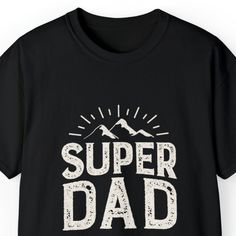 Show your appreciation for the super dad in your life with our 'Super Dad Men's Tee.' This stylish and comfortable Father's Day T-shirt features a striking mountain landscape background, making it the perfect gift for adventurous dads. Whether he's conquering mountains or simply being the superhero dad at home, this tee celebrates his strength and love. Available in various sizes, it's a thoughtful and meaningful gift for Father's Day or any occasion. Order yours today and let your super dad wea Father's Day Outdoor T-shirt With Graphic Print, Father's Day Outdoor Graphic Print T-shirt, Father's Day Outdoor Graphic T-shirt, Mountain Tee, Landscape Background, Super Dad, Father's Day T Shirts, Mountain Landscape, Gifts For Father