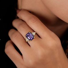 Don't miss this opportunity to own this beautiful gemstone ring! => Gemstone Type - Amethyst, Clear Quartz => Gemstone Cut - Faceted => Gemstone Size - 8*10 mm, 2 mm => Total Number of Gemstones - 7 => Metal Type - 14k Gold Filled (Tarnish Resistant and Nickel Free) - also available in 925 sterling silver and 14ksolid gold * Please contact me for pricing on sizes larger than 11 * ~ Feel free to ask me about custom made designs. ❏ Replacements and custom orders: ✪ 925 sterling silver - no additio Luxury Three Stone Gemstones For Anniversary, Luxury Yellow Gold Amethyst Ring With Emerald Cut, Luxury Square Cut Sapphire Ring, Luxury Sapphire Ring With Emerald Cut And Gemstone Accents, Luxury Emerald Cut Sapphire Ring With Gemstone Accents, Luxury Emerald-cut Sapphire Ring With Gemstone Accents, Elegant Emerald-cut Sapphire Ring With Gemstone Accents, Luxury Amethyst Rings With Gemstone Accents, Luxury Amethyst Ring With Emerald Cut Diamond