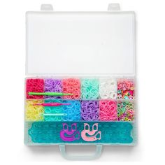 a box filled with lots of different colored beads and scissors in it's holder