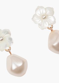 The Mina Earrings pair two of our favorite things: flowers and glowing pearls to create a style that is incredibly versatile. A single baroque crystal pearl falls from a central mother of pearl flower, adding a subtle length and sense of movement. These luminous earrings make styling effortless, no matter the occasion. Discover more of our earring silhouettes. Luxury Hair Accessories, Luxury Hair, Pearl Flower, Crystal Pearls, Baroque Pearls, Rhodium Plated, Post Earrings, Mother Of Pearl, Favorite Things