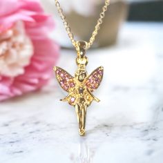 This fairy princess gold necklace is beautifully crafted with pink jewels on the wings. A fabulous gift idea. Gold chain. Suitable for children age 3 and over. Chain length 71/2 in. Baby Bible, Earth Baby, Earth Mama, Pink Jewels, Fairy Necklace, Fairy Princess, Fairy Princesses, The Wings