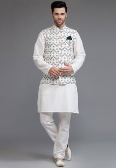 Cotton Silk Kurta with a Cotton Silk Pant in Off White Color. Available with a Cotton Silk Nehru Jacket in Off White color. This Chinese Collar Neck and Half Sleeve Ready-made attire is Enhanced with Buttons and Digital Print.   Do note: Brooch and Footwear shown in the image is for presentation purposes only. Half to one inch may vary in measurement. (Slight variation in actual color vs. image is possible) We Sell all kinds of Menswear. Mens Kurta | Mens Kurta & Pant | Traditional Menswear | Ge White Cotton Nehru Jacket For Festive Occasions, White Cotton Sherwani For Spring, Festive White Cotton Nehru Jacket, White Fitted Nehru Jacket For Transitional Season, White Traditional Bandhgala For Spring, White Nehru Jacket With Stand Collar For Festive Occasions, White Long Sleeve Bandhgala For Spring, White Festive Transitional Outerwear, Festive Transitional White Outerwear