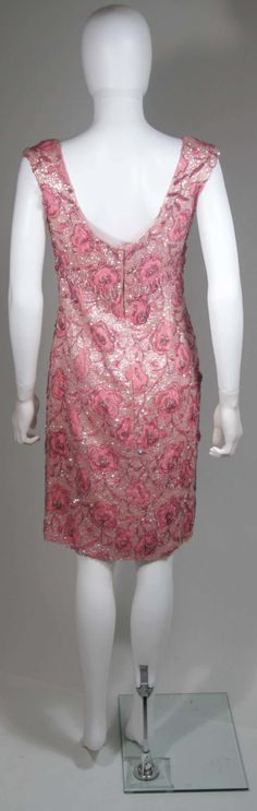 For Sale on 1stDibs - This vintage cocktail dress is composed of a pink floral brocade fabric embellished with sequins and beading. There is a center back zipper closure. In Vintage Cocktail Dress, Cocktail Dress Vintage, Beaded Cocktail Dress, Vintage Cocktail, Brocade Fabric, Hand Beading, Pink Floral, Flapper Dress, Beading