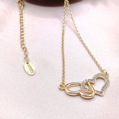 Celebrate timeless love with this Double Heart Necklace. With a sense of romance and passion, this delicate piece is the absolute way to profess your love. This can be a wonderful gift for the lady in your life and can be totally worn for day or evening formal events. You can pair this refined piece with the matching ring to complete your look. Features: Comfortable to wear Lightweight High quality Tarnish resistant Lobster clasp Size & Material: Zinc Alloy Available in: 18k Gold, Rose Gold, Rho Elegant Double Heart Cubic Zirconia Necklace, Double Heart Necklace With Adjustable Chain For Anniversary, Elegant Heart Necklace With Adjustable Cubic Zirconia Chain, Double Heart Cubic Zirconia Necklace With Diamond Accents, Double Heart Necklace With Diamond Accents In Cubic Zirconia, Elegant Heart Necklace With Adjustable Chain For Anniversary, Double Heart Diamond Accents Necklace For Anniversary, Elegant Promise Necklace For Valentine's Day, Double Heart Diamond Necklace For Anniversary