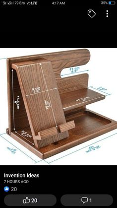 an open wooden box with measurements on the bottom and inside, sitting on top of a table