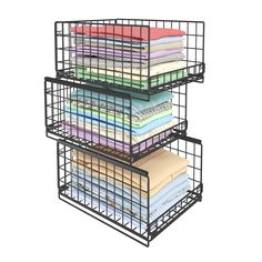 three tiered metal storage basket with folded sheets