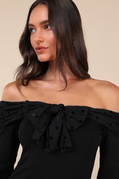 You'll be the center of attention in any room when you're wearing the Lulus Major Charisma Black Off-the-Shoulder Bow Long Sleeve Top! Stretchy ponte knit shapes this flattering top that has long sleeves and an off-the-shoulder neckline with a mesh-style overlay that has tonal velvet polka dots and forms a bow at the front. Fitted bodice continues down to a lightly cropped hem. Fit: This garment fits true to size. Length: Size medium measures 15" from top to bottom. Bust: Great for any cup size. Fitted Off-shoulder Top For Party, Fitted Off-shoulder Top For Fall Party, Fitted Black Cold Shoulder Top, Cold Shoulder Off-shoulder Top For Evening, Fitted Cold Shoulder Blouse For Party, Fitted Black Off-shoulder Top, Black Fitted Off-shoulder Top, Black Long Sleeve Off-shoulder Party Top, Black Long Sleeve Off-shoulder Top For Party