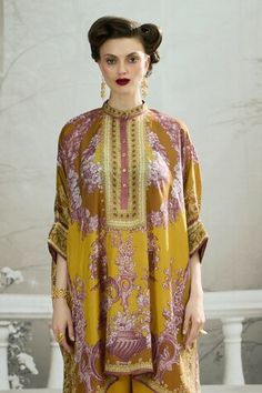 Mustard yellow silk asymmetric hem kaftan style tunic with floral print and buttoned placket. - Aza Fashions Yellow Silk Long Sleeve Kurta, Silk Straight Kurta Tunic For Eid, Elegant Yellow Silk Kaftan, Elegant Yellow Kaftan For Eid, Festive Long Sleeve Yellow Kaftan, Elegant Yellow Straight Kurta Dress, Yellow Silk Dress For Eid, Rajdeep Ranawat, Kaftan Tunic