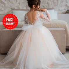 PERFECT FLOWER GIRL DRESS✨ Make order today and SAVE 15%🎁delivery 3-4 days only! Beautiful Baby Flower girl dress with lace embroidery and amazing puffy skirt! Process time: 1-2 working days Delivery time: 2-4 working days  Also offer express overnight delivery https://www.etsy.com/listing/1298332912/express-delivery?click_key=eb8207bd8376c2fa762384c4d5701f79c6bcbc77%3A1298332912&click_sum=63123b47&ga_search_query=express&ref=shop_items_search_1&frs=1 *Train is detachable & all dresses have bow White Pageant Dress With Lace Bodice For Bridesmaid, Princess Style Cream Dress With Tulle Skirt, White Princess Dress With Tulle Skirt For Bridesmaid, Cream Tutu Dress For Pageant, Cream Tulle Tutu Dress For Bridesmaids, White Princess Dress For Bridesmaid, White Princess Pageant Dress For Bridesmaid, White Tutu Dress For Wedding, Cream Tulle Tutu Bridesmaid Dress