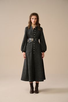 Enjoy the elegance and warmth of the season！ With its antique-style metal buttons and a loose silhouette, this luxurious wool coat is a cosy way to enhance your autumn/winter look. Exquisitely hand-woven, this coat is known for its durability, warmth and distinctive texture, effortlessly exuding your alluring fashion presence.   Indulge in the luxurious allure of our wool coat, crafted with a yarn-dyed technique that gives it a unique starry texture that will make you shine like a star! Featuring a maxi length, loose silhouette, Single-breasted, metal buttons, and versatile colours, the large patch pockets are practical and add a unique sense of design, making it easy to create a retro British vintage style. As you wear this coat, imagine yourself walking through the rolling hills of Scotl Wool Coat With Buttons, Wool Coat With Buttons And Long Sleeves, Long Wool Coat With Buttons, Winter Wool Button-up Coat With Buttons, Button-up Wool Coat For Winter, Winter Wool Button-up Coat, Winter Button-up Wool Coat With Button Closure, Wool Coat With Buttons For Workwear, Elegant Long Sleeve Wool Coat With Buttons